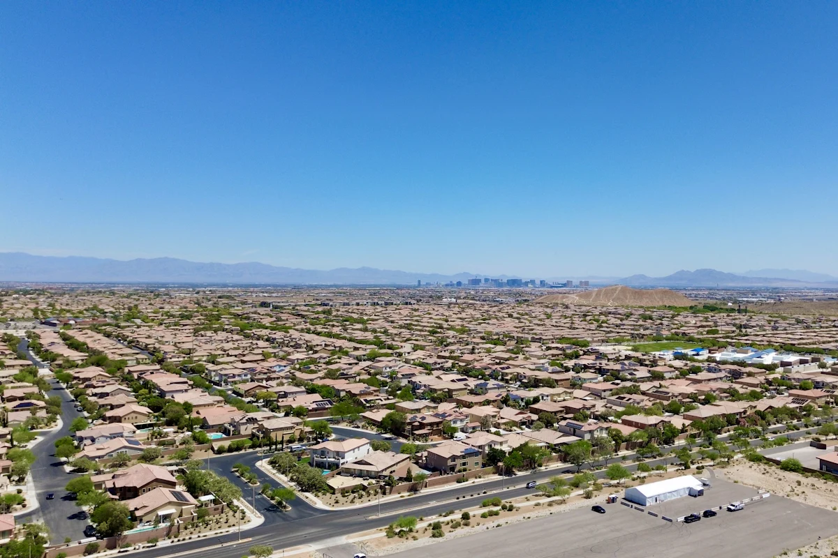 Las Vegas neighborhoods from above, with the Strip and mountains in the distance